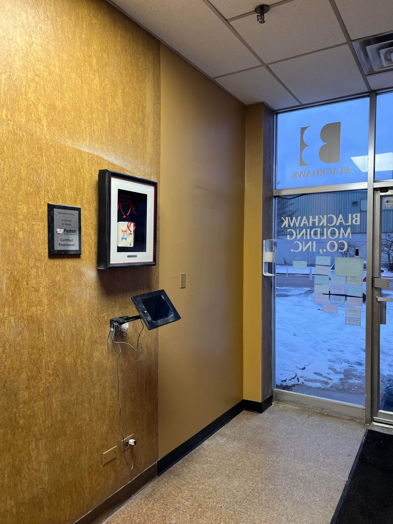 Commercial entryway with finished painted walls and trim
